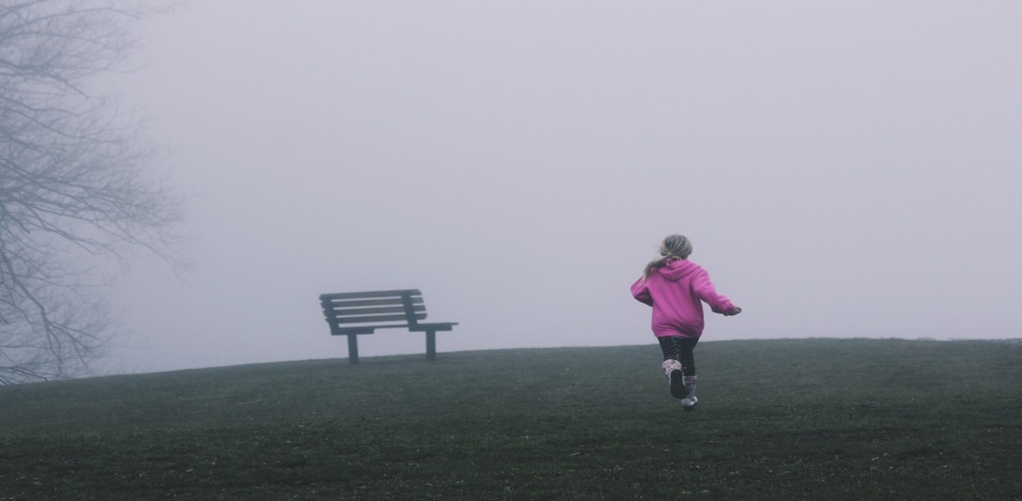 A child running on a foggy day

Description automatically generated